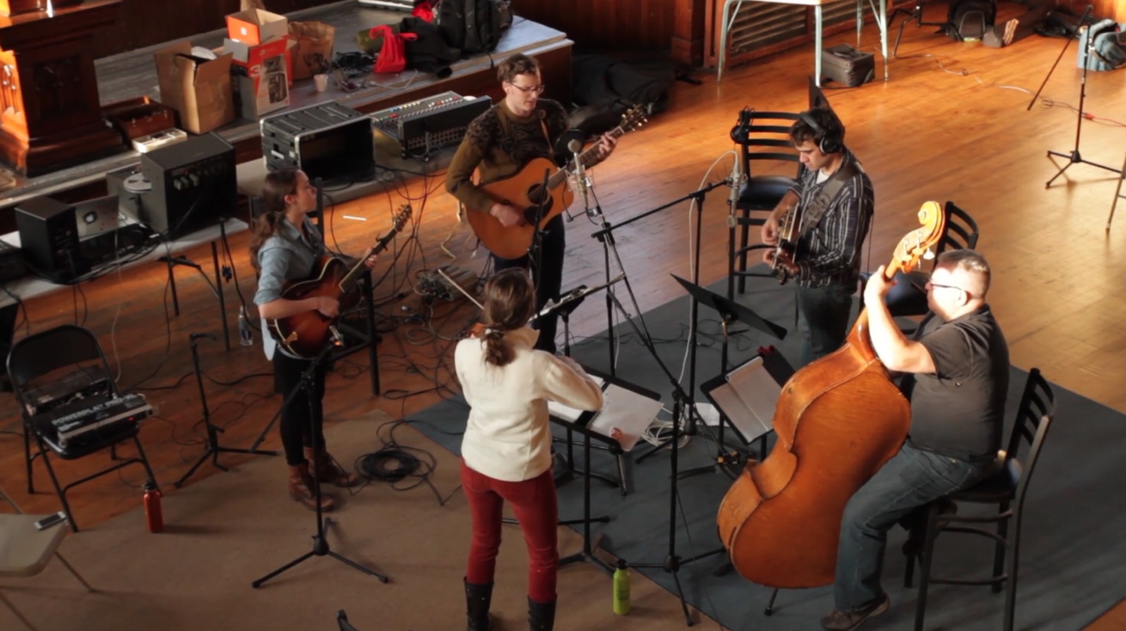 Musicians recording in a church studio